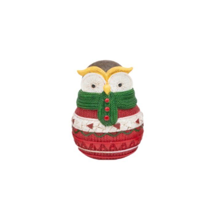 Knitted owl ornament wearing a red sweater with white patterns and a green scarf on a white background