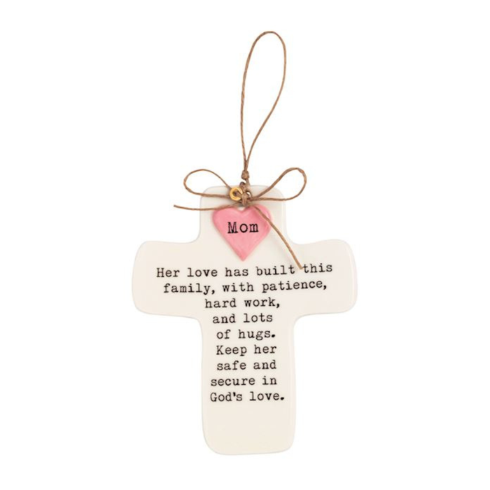 Decorative cross with sentimental message and pink heart on a white background