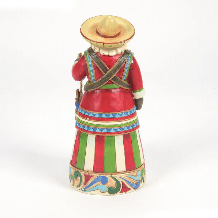 Colorful figurine with a traditional outfit and hat on a white background