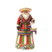 Colorful figurine of a Santa Claus-like character with a sombrero on a white background
