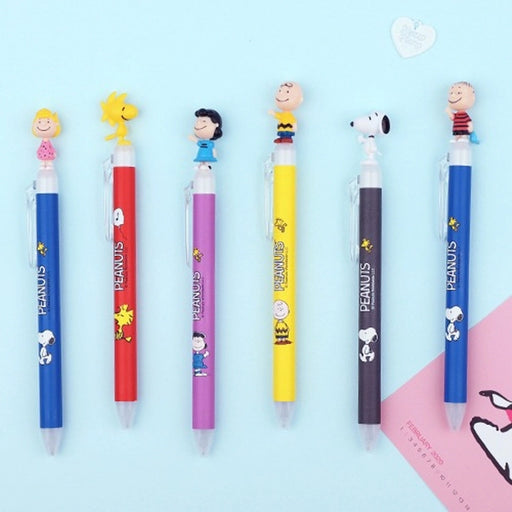 Set of Peanuts-themed pens on a light blue background