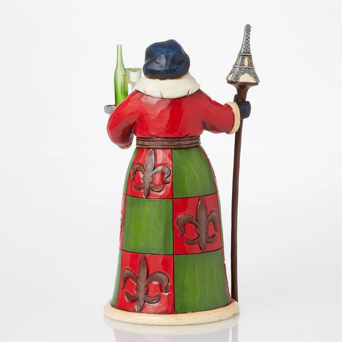 Colorful figurine with a checkered dress, hat, and staff on a white background
