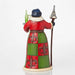 Colorful figurine with a checkered dress, hat, and staff on a white background