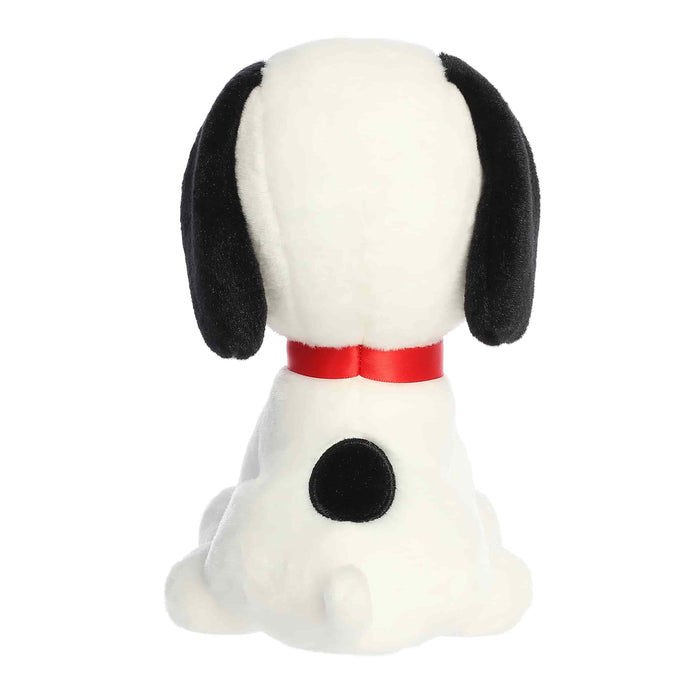 Plush dog toy with a red collar on a white background