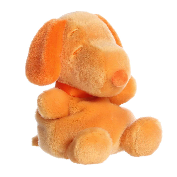 Orange plush dog toy on a white background