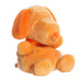 Orange plush dog toy on a white background
