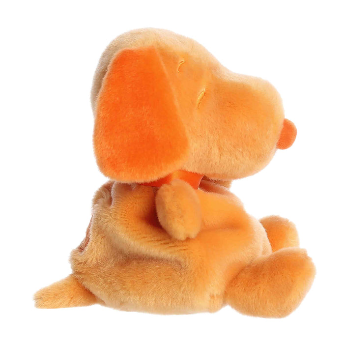 Orange plush dog toy on a white background