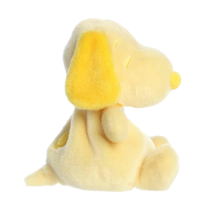 Yellow plush dog toy on a white background