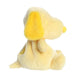 Yellow plush dog toy on a white background