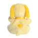 Yellow plush toy with a bow on a white background