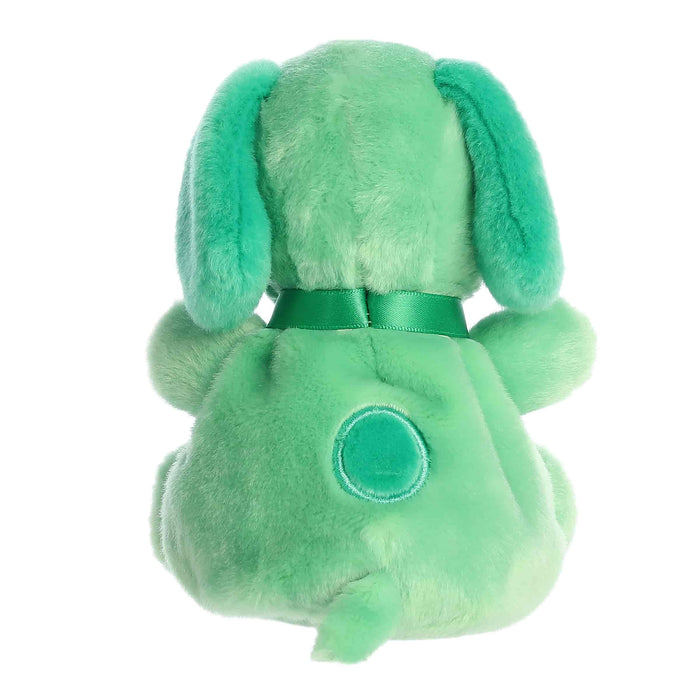 Green plush toy with a bow on a white background