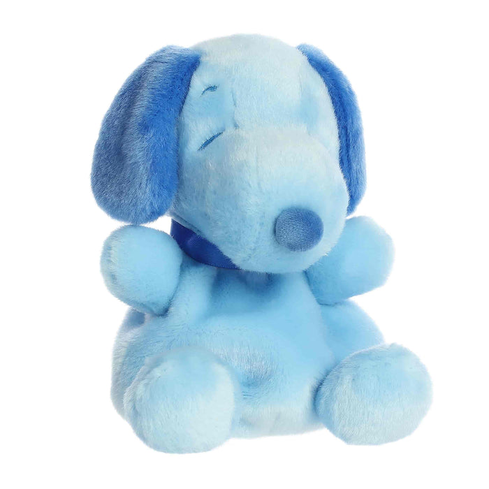 Blue plush dog toy on a white background