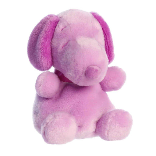 Pink plush dog toy on a white background