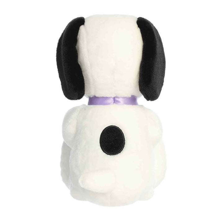 Plush dog toy with a purple collar on a white background