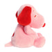 Pink plush toy with a red nose on a white background
