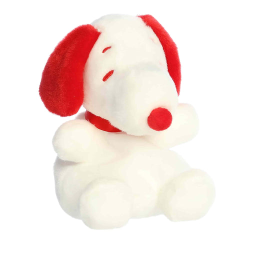 Plush toy resembling a dog with red ears and nose on a white background