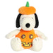 Plush toy resembling a dog in a Halloween costume with a pumpkin hat on a white background