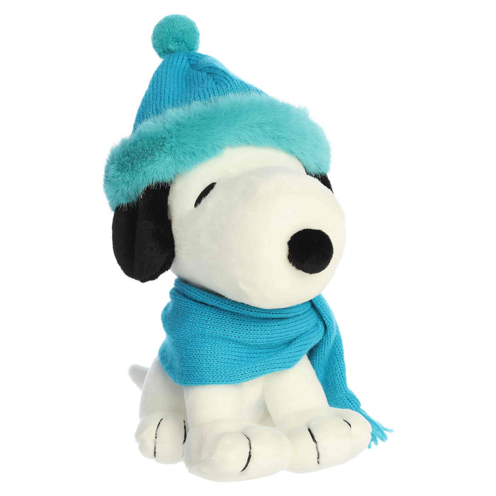 Snoopy plush with blue hat and blue scarf on a white background