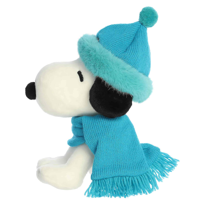 Snoopy plush with blue hat and blue scarf on a white background