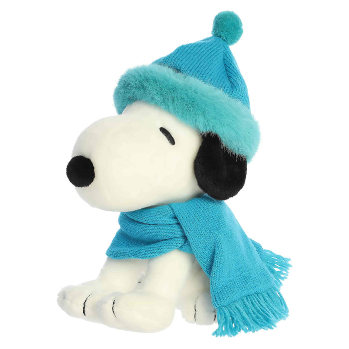 Snoopy plush with blue hat and blue scarf on a white background