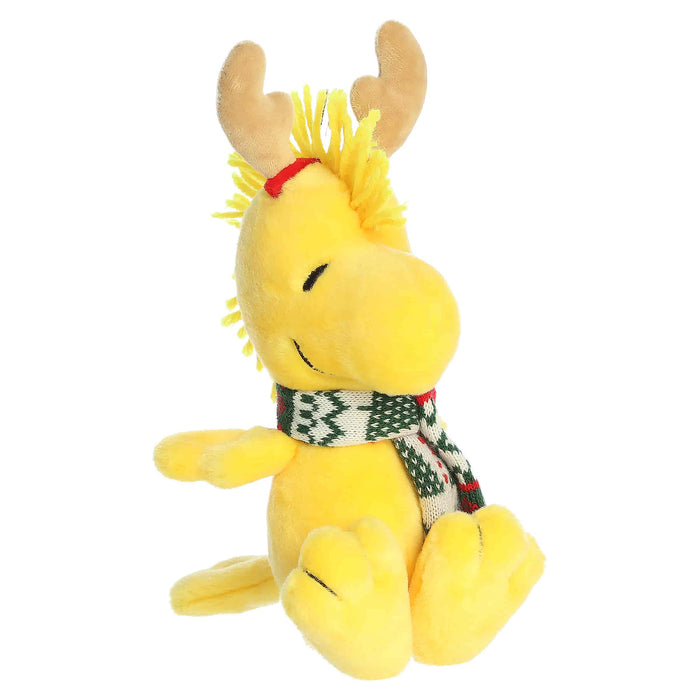 Woodstock plush with reindeer antlers and a scarf on a white background