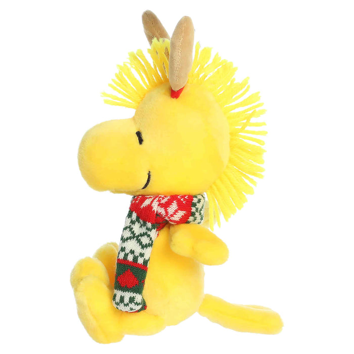 Woodstock plush with reindeer antlers and a scarf on a white background