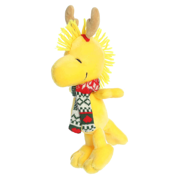Woodstock plush with reindeer antlers and a scarf on a white background