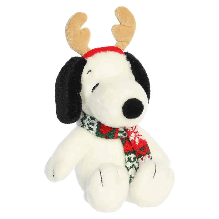 Snoopy plush with reindeer antlers and a scarf on a white background