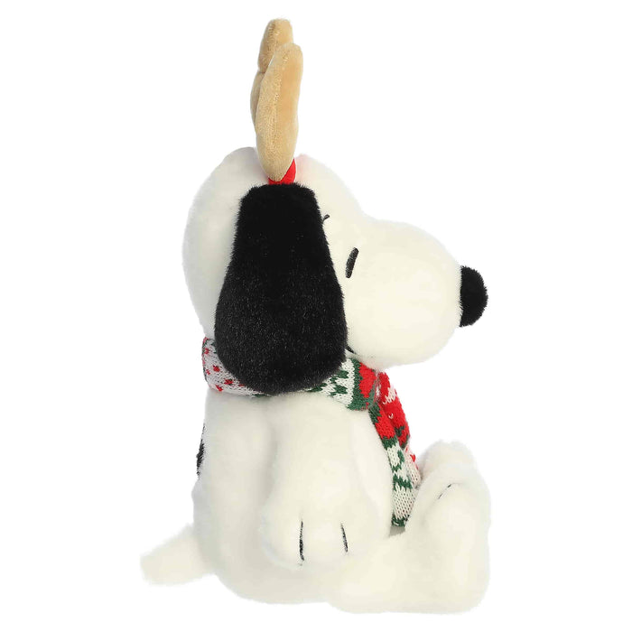 Snoopy plush with reindeer antlers and a scarf on a white background
