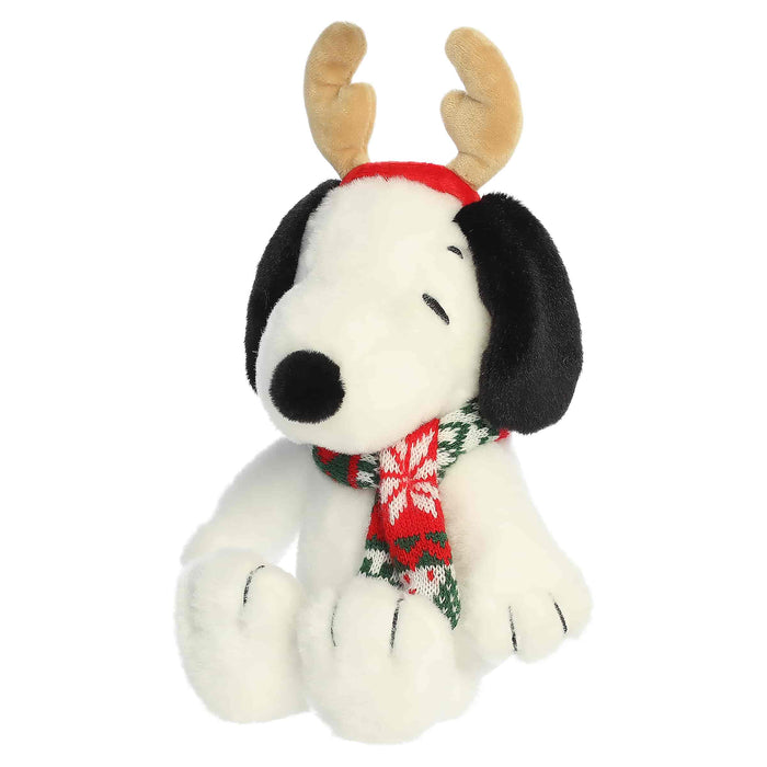 Snoopy plush with reindeer antlers and a scarf on a white background