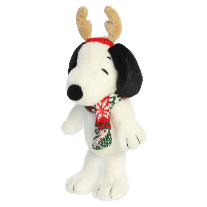 Snoopy plush with reindeer antlers and a scarf on a white background