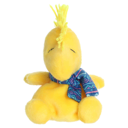 Woodstock plush toy with a blue winter pattern scarf on a white background
