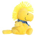 Woodstock plush toy with a blue winter pattern scarf on a white background