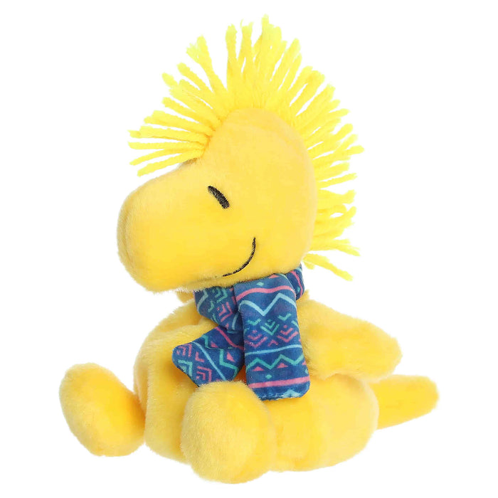 Woodstock plush toy with a blue winter pattern scarf on a white background