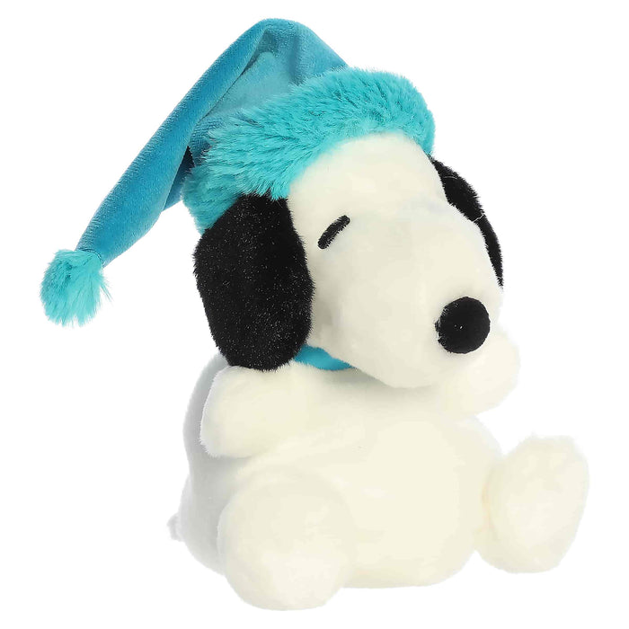 Snoopy plush toy with a blue winter hat on a white background