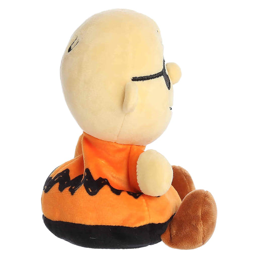 Plush toy of a character in an orange outfit with a white background