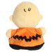 Plush toy resembling a character with a bald head, orange shirt, and black pants on a white background