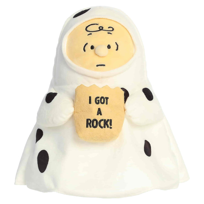 Plush toy resembling a character from Peanuts with a rock and 'I got a rock!' text on a white background