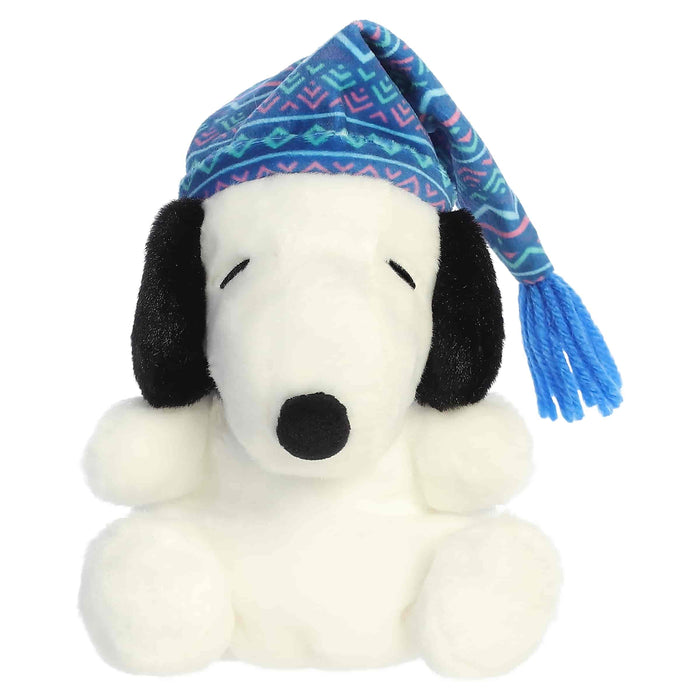 Snoopy plush toy with a blue winter-pattern hat on a white background