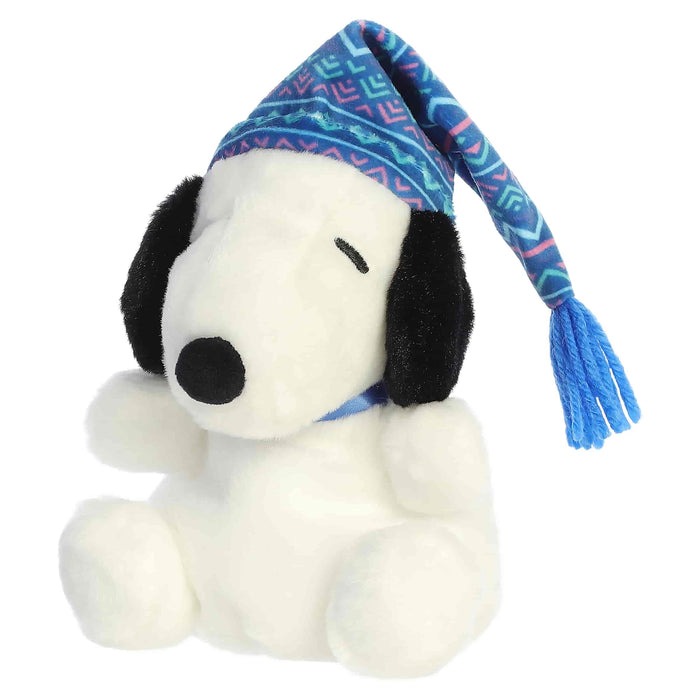 Snoopy plush toy with a blue winter-pattern hat on a white background