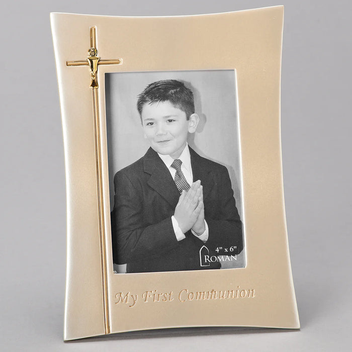 Gold photo frame with a cross on a gray background