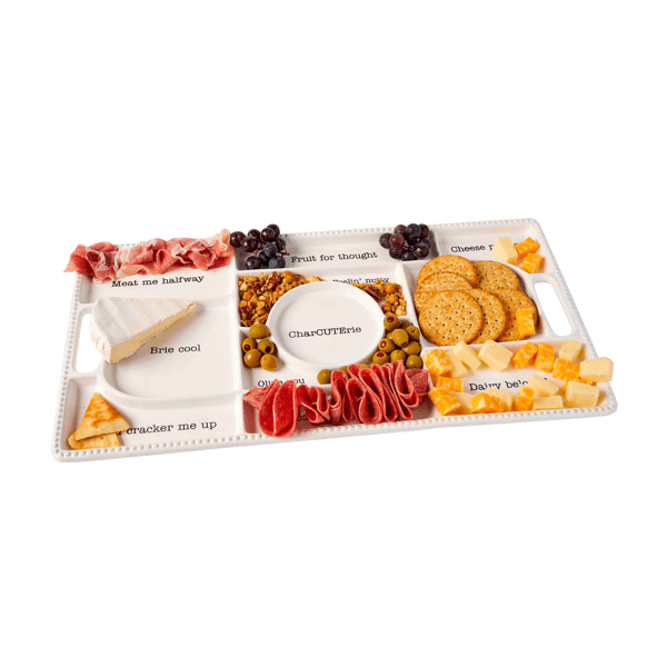 Charcuterie board with various food items on a white background