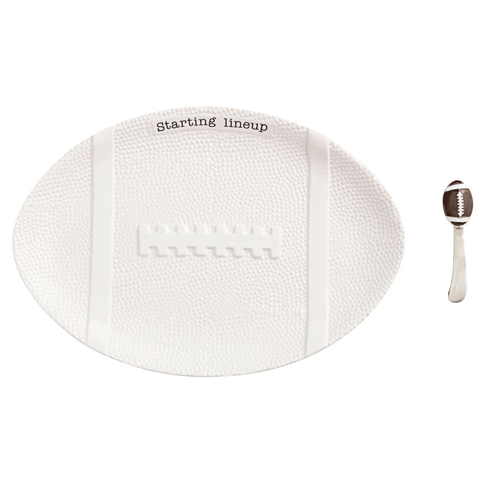 White football-shaped toy with 'Starting lineup' text and a small football figure on a white background