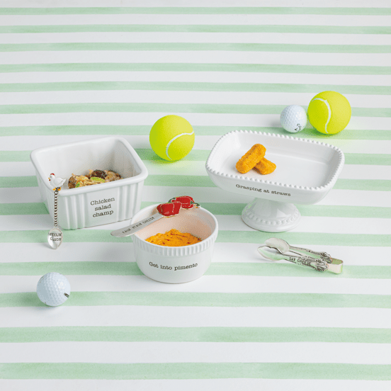 Pet toys and treats on a striped green and white background