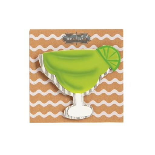 Green margarita glass with lime wedge on a wavy patterned background