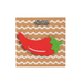 Red pepper-shaped object on a wavy line patterned card with 'mudpie' branding.