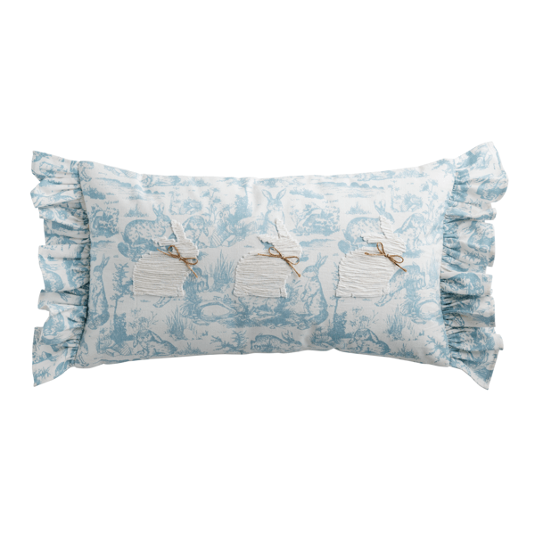 Decorative pillow with ruffled edge and blue floral pattern on a white background
