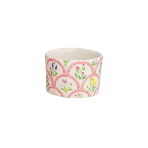 Floral patterned cupcake liner on a white background