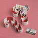 Red and white striped candy cane-shaped containers with photos on a red and white striped background