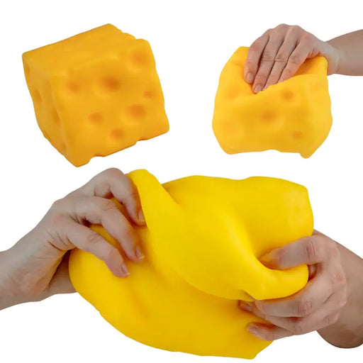 Yellow sponges being held and squeezed by hands on a white background